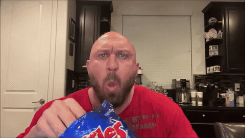 Bald guy eating chips
