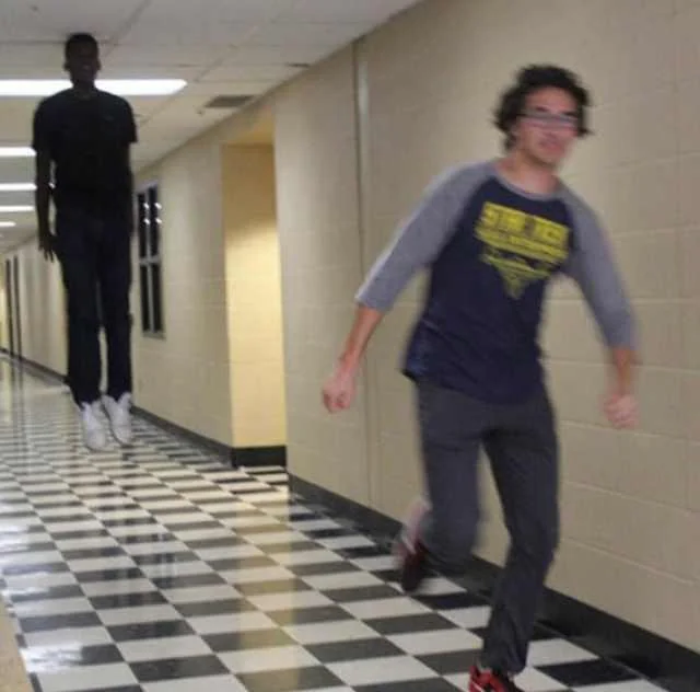 Floating boy chasing running boy